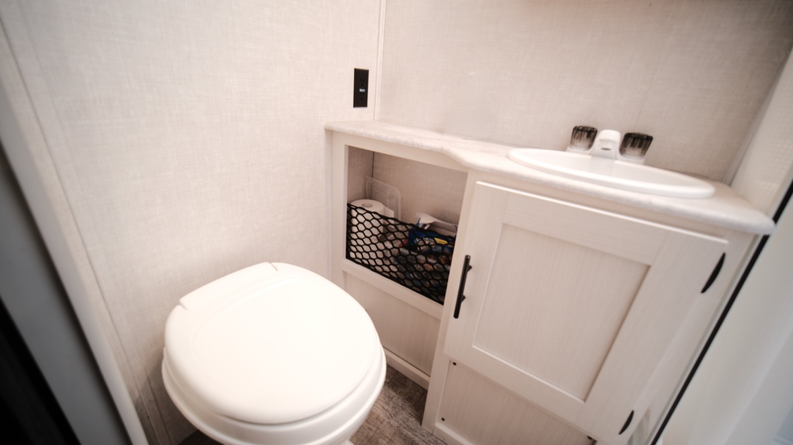 Bathroom with a flush toilet and vanity sink