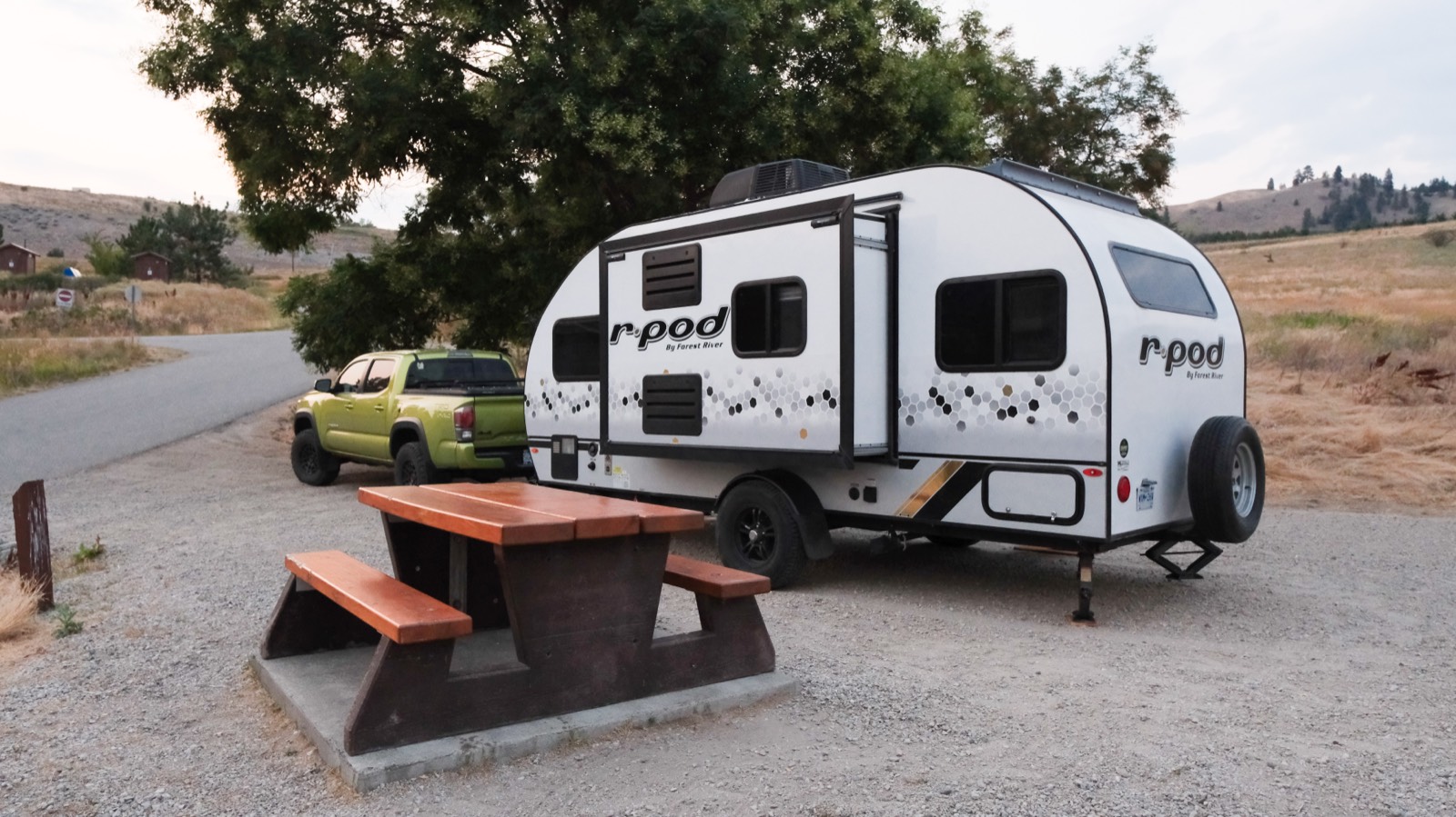 The R-Pod parked at a campsite next to a picnic table