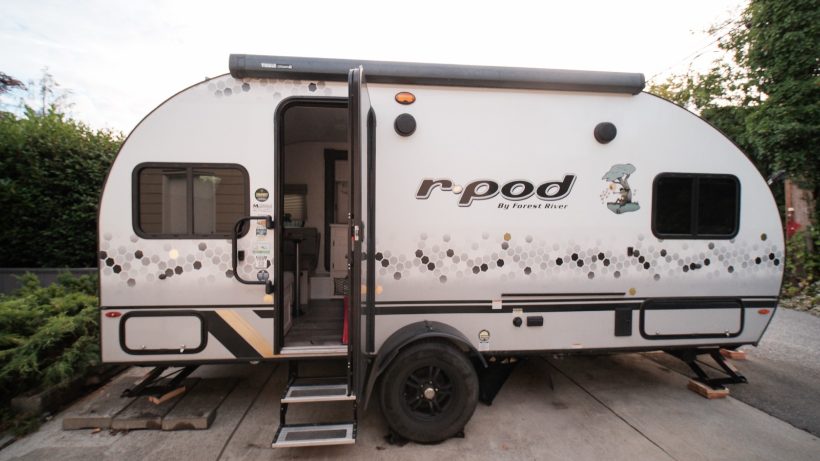 Side view of the R-Pod with the entry door open and step down