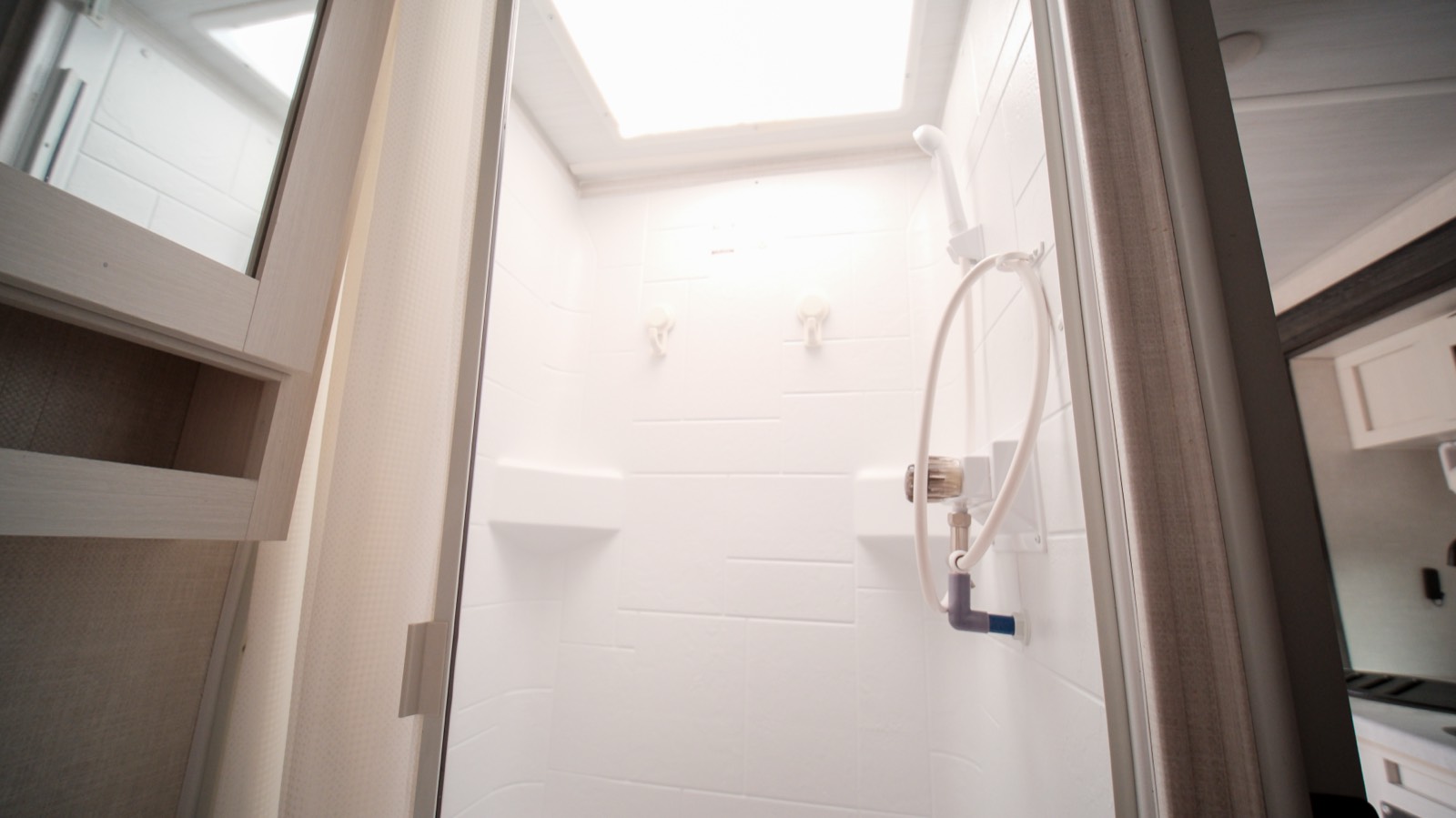 Enclosed shower with a skylight
